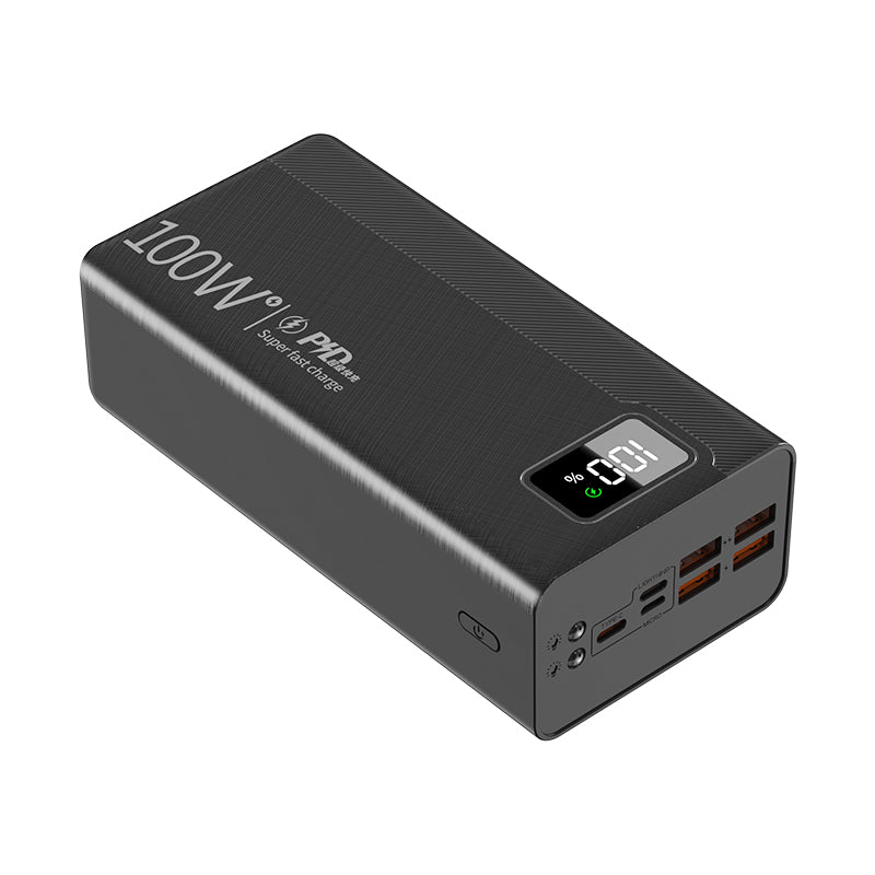 The picture shows a black portable power bank with a 100W PD label on it, featuring a digital display showing "100" and multiple charging ports.
