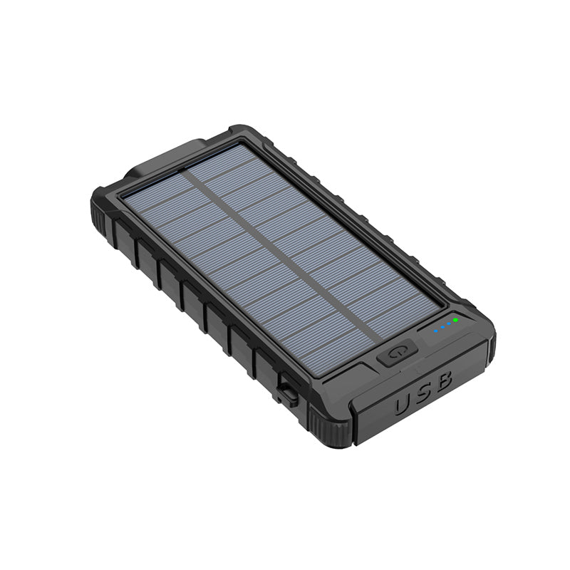 The picture shows a black portable power bank with a solar panel on the top surface, a USB port, and indicator lights on the bottom edge.
