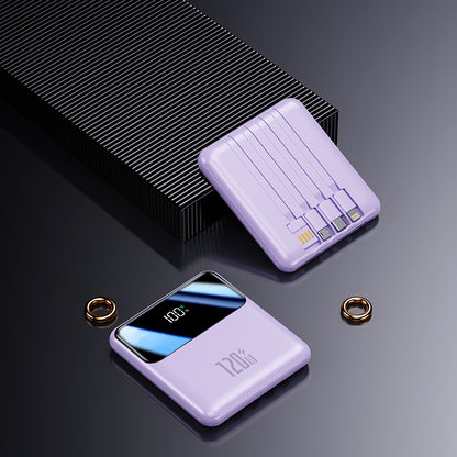 The image shows a purple potable power bank with three charging cables and a USB cable to connect directly to the socket or charging head, a digital screen and a looped strap for easy carrying.