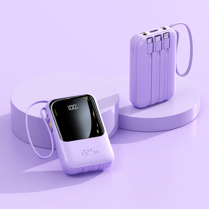 The picture shows a purple portable power bank with a digital display on one side showing that the charge level is 100% and has 22.5W fast charging capability. There are multiple ports on the top of the other side.