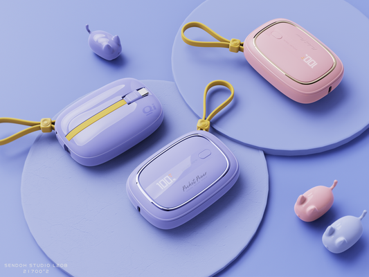 The picture shows three portable power banks with cute designs in pastel colors, each featuring a strap and some marked with "10000mAh" and "Qi" indicating their charging capacity and wireless charging capability.
