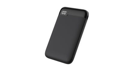 The picture shows a black portable power bank with a digital display indicating a 100% charge.
