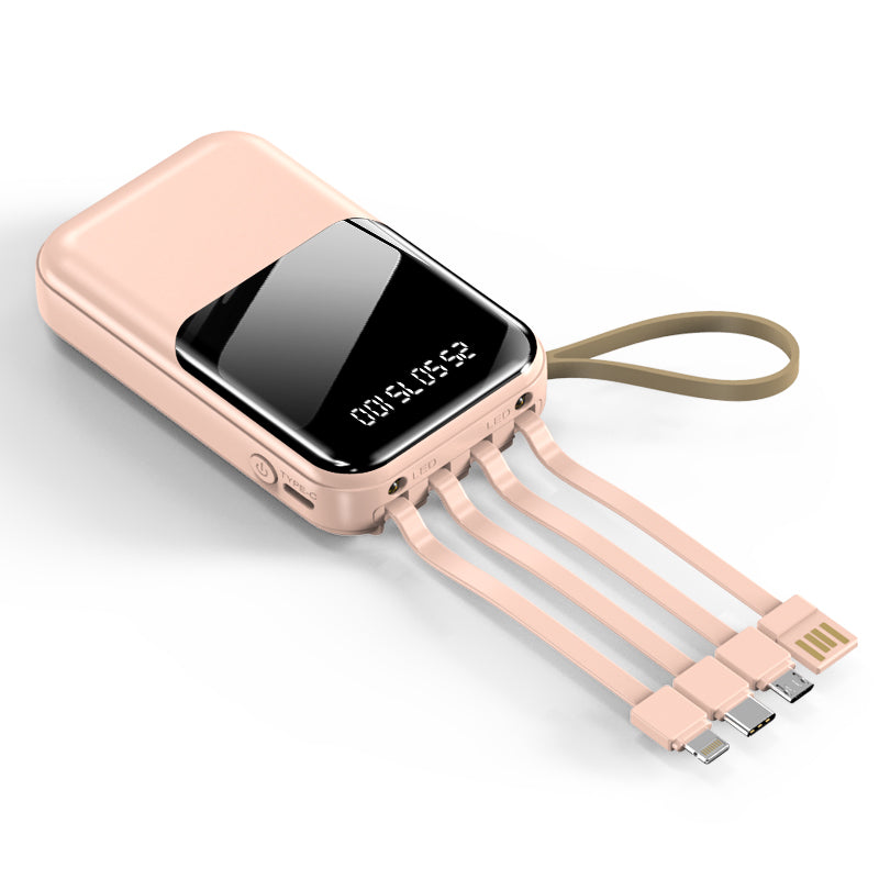 The picture shows a white portable pink power bank with a digital display and multiple charging cables and wrist straps.