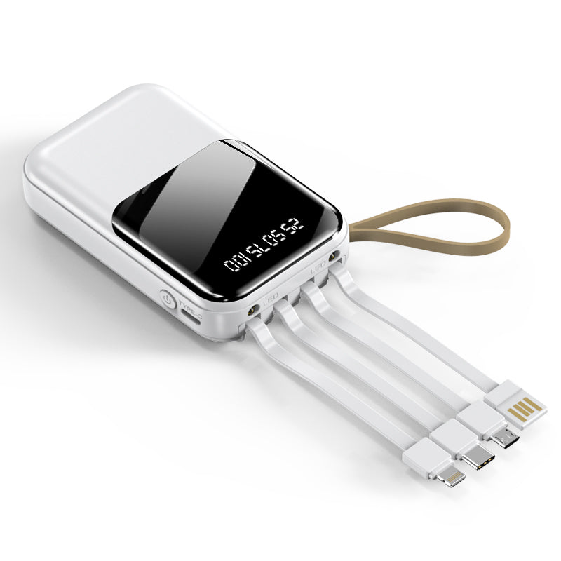 The picture shows a white portable white power bank with a digital display and multiple charging cables and wrist straps.