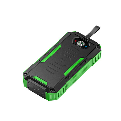 The picture shows a portable solar power bank with a rugged design, featuring green and black colors, a strap for carrying, and a built - in compass on the top surface.
