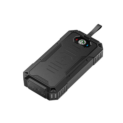 The picture shows a portable solar power bank with a rugged design, featuring black color, a strap for carrying, and a built - in compass on the top surface.