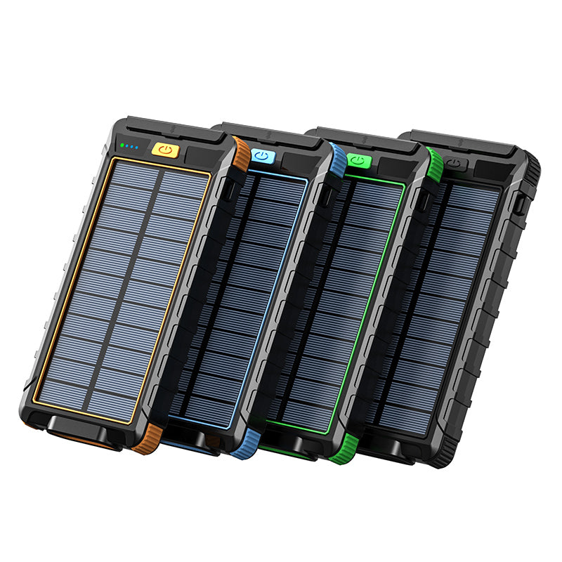 The picture shows four solar - powered power banks with rugged, multi - colored designs, each featuring a solar panel on the front and control buttons on the top.
