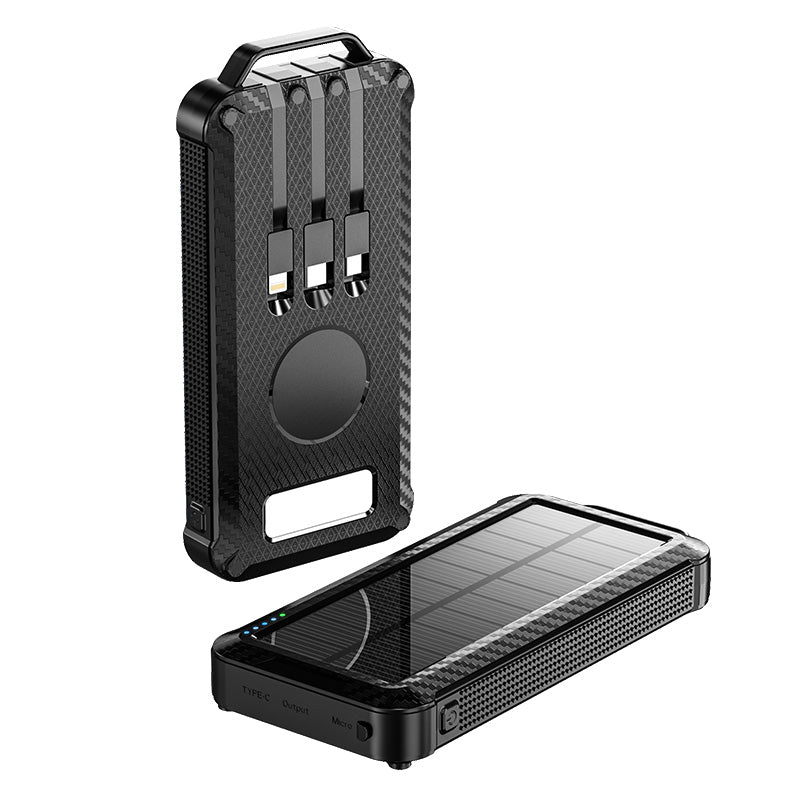 The picture shows a black portable solar power bank with a rugged design, featuring a solar panel on one side for charging, multiple output ports on the other side, and a handle for easy carrying.