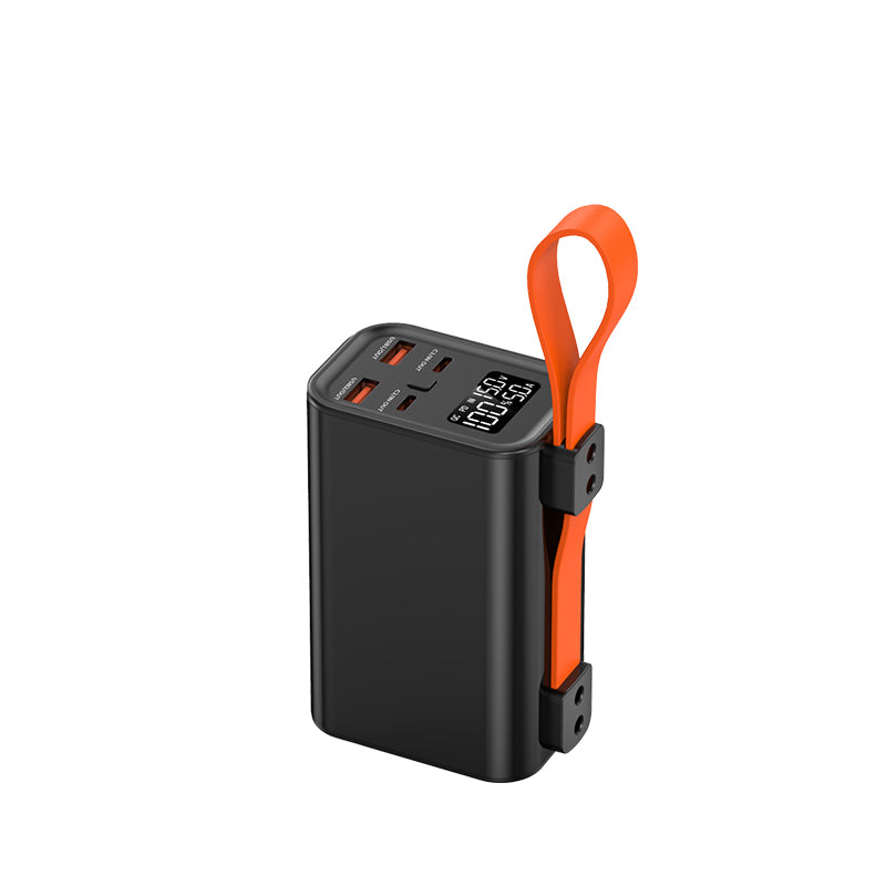 The picture shows a portable power bank with a black body, an orange strap, multiple charging ports, and a digital display showing "100:50".
