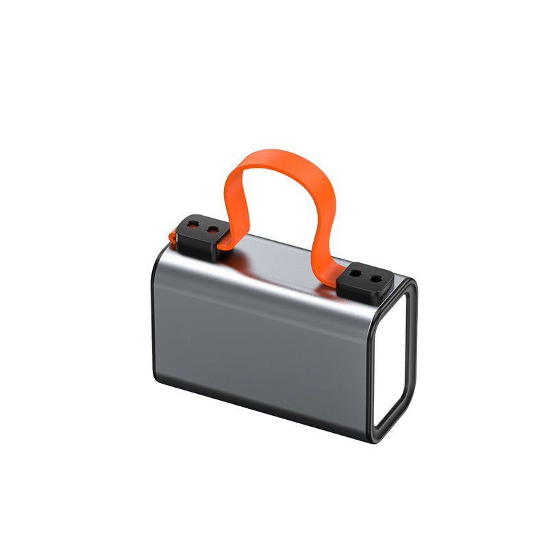 The picture shows a sliver mobile power bank with an orange handle on the top and a light on one side.