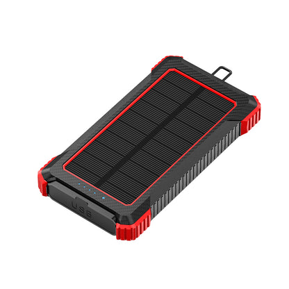 The picture shows a portable power bank with a solar panel on the top surface, featuring a rugged design with red and black colors, and having a USB port on the side.
