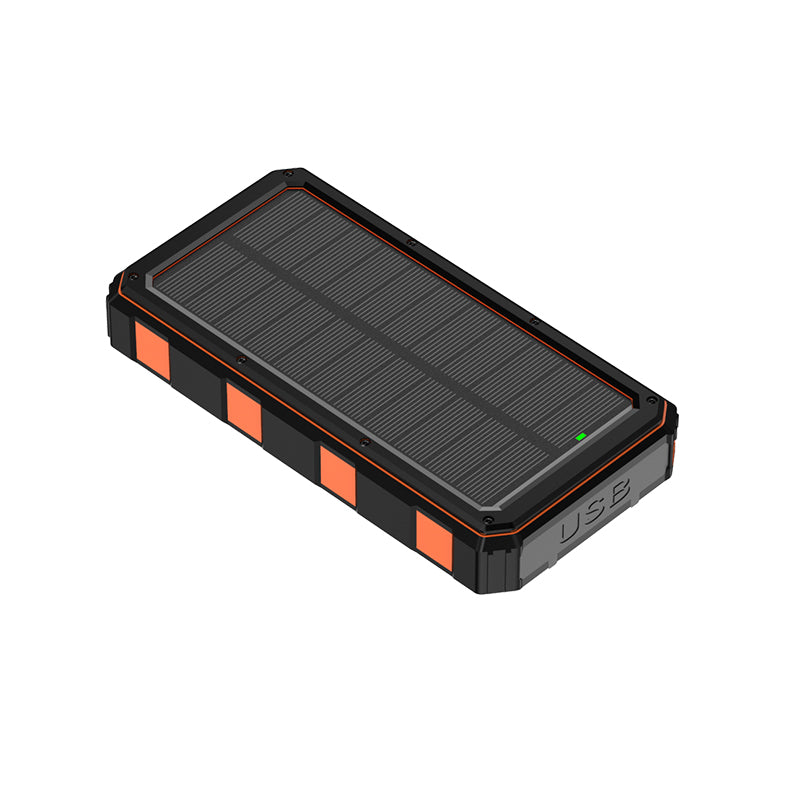 The image depicts a portable power bank with a solar panel on its top surface, featuring a black and orange design, and has a USB port indicated by the text "USB" on its side.
