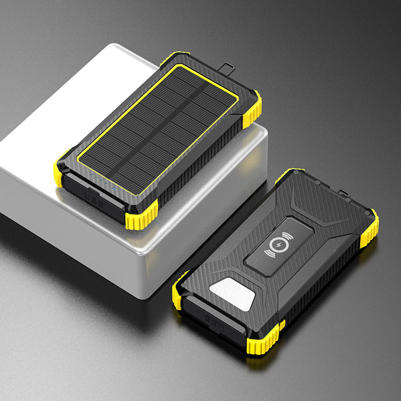 Pictured are two portable yellow power banks with solar panels on top, one with a USB port indicated by a blue light, and the other with a wireless charging symbol.