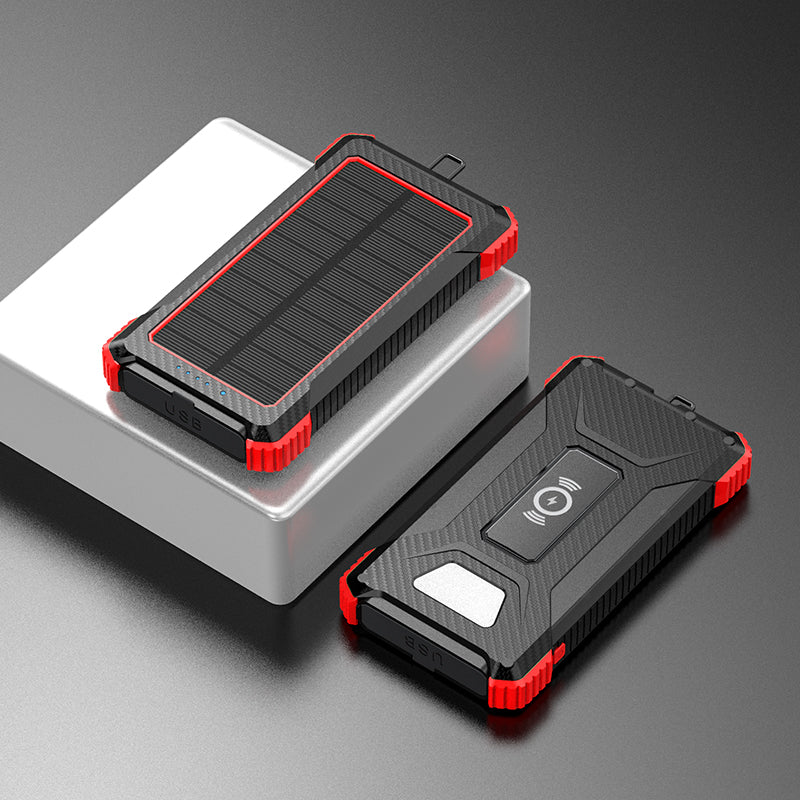 Pictured are two portable red power banks with solar panels on top, one with a USB port indicated by a blue light, and the other with a wireless charging symbol.