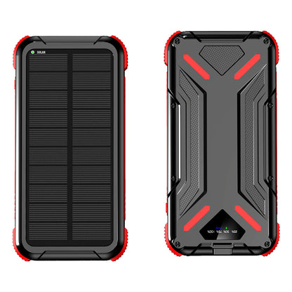 The picture shows a portable red solar power bank with a rugged design, featuring a solar panel on one side for charging and multiple output ports along with an LED indicator on the other side.
