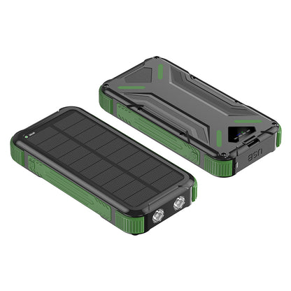 The picture shows a portable green solar power bank with a rugged design, featuring solar panels on one side and multiple ports for charging on the other.