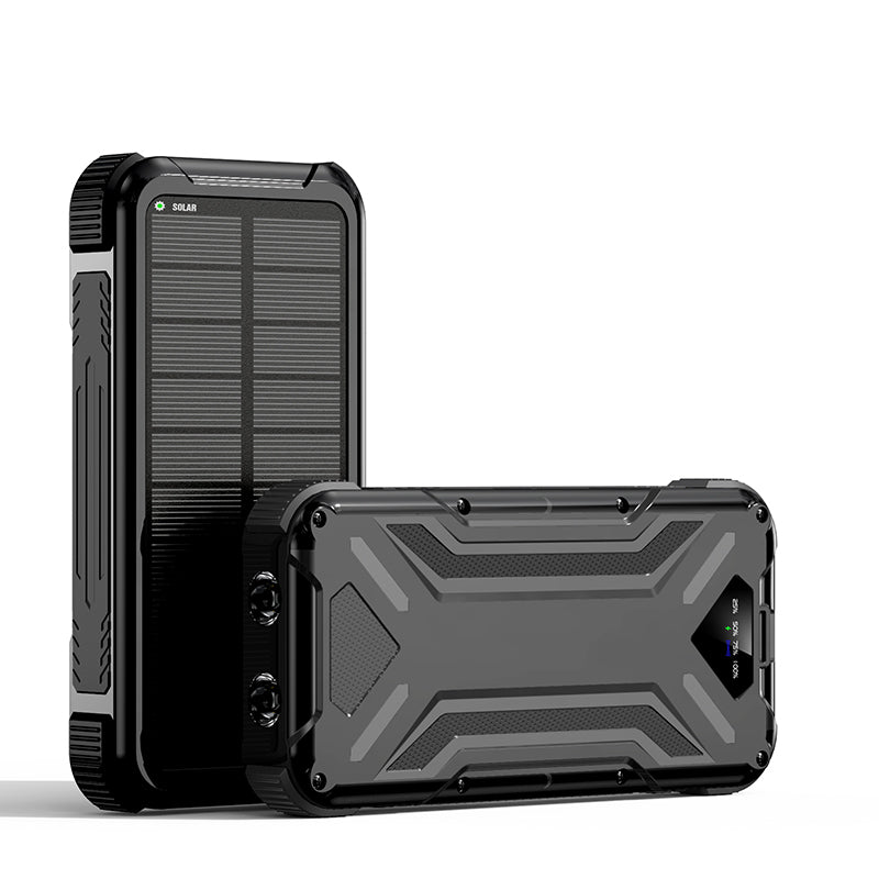 The picture shows a black portable power bank with a rugged design and a solar panel on its surface.